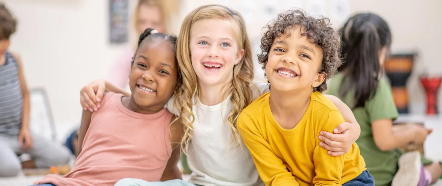 Friends sitting together at daycare.