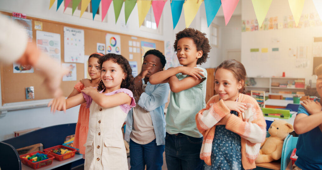 Education, dance and group of kids in classroom together for coordination or motor skills development. Children, learning or study with boy and girl students in school for scholarship as friends